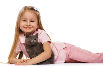 Little cute girl with a gray british kitten