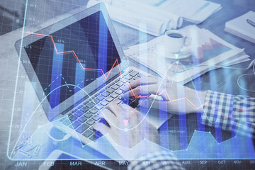 Double exposure of forex graph with man working on computer on background. Concept of market analysis.