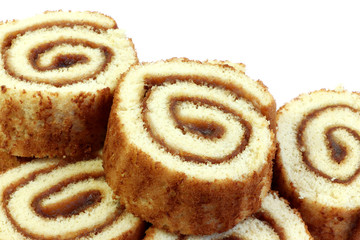 Swiss sweet roll with jam isolated, slices of homemade sponge roll cake isolated