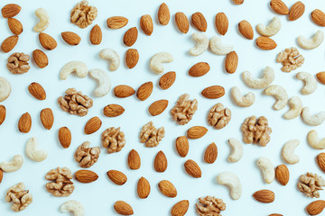 nuts are scattered on the table, a healthy food concept