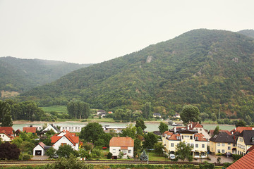 Fototapeta na wymiar picturesque European town far away. Scenic mountain landscape with small old beautiful village