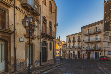Naklejka na ściany i meble Empty street in the famous ceramic town Caltagirone at sunrise in province of Catania in Sicily