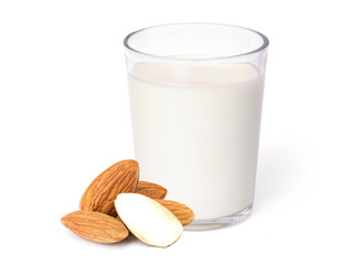 Glass of Almond milk and almond seeds isolated on white. Healthy drinks concept.