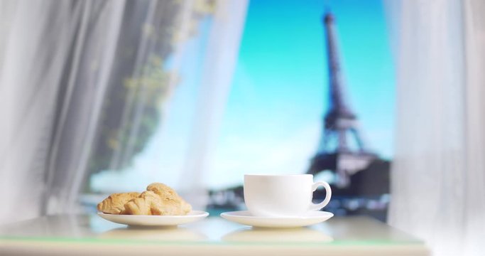 the Eiffel Tower from the hotel window. Coffee and croissant on white table on Paris background. Travel to Paris. Honeymoon. Restaurant near the Eiffel Tower. With close up. 4K