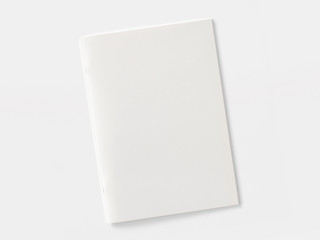 Blank magazine or brochure isolated on white. Front cover top view as mockup template for your design presentation