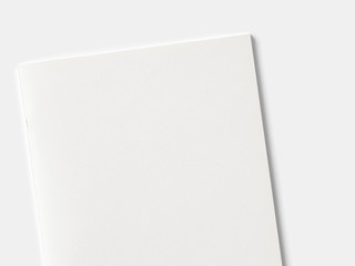 Blank portrait magazine or brochure isolated on white. Front cover top view as mockup template for your design presentation