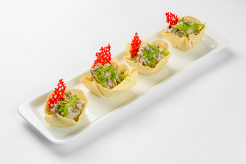 Snack baskets on a glass plate. Catering service