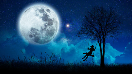 Fototapeta na wymiar imagination The girls are cradling amidst many stars and full moon at night.