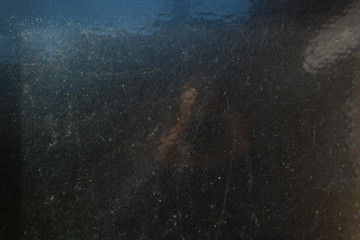 plain glass background illuminated by sunlight and with a slight reflection