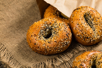Freshly Baked Bagels Topped with Sesame Seeds, Poppyseeds, Garlic and Onion. Selective focus.