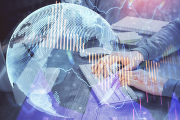 Double exposure of financial graph with man works in office on background. Concept of analysis.