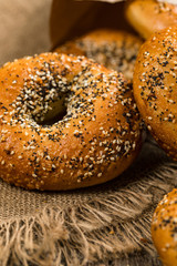 Freshly Baked Bagels Topped with Sesame Seeds, Poppyseeds, Garlic and Onion. Selective focus.