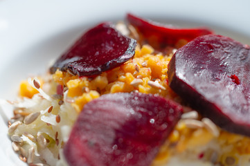 delicious salad on a white plate  with kohlrabi, beetroot, lentils and grains