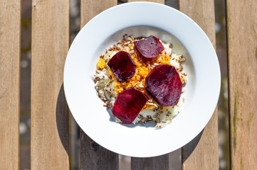 Fototapeta na wymiar delicious salad on a white plate with kohlrabi, beetroot, lentils and grains