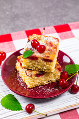Summer Tart Cherry Cake with Powdered Sugar. Selective focus.