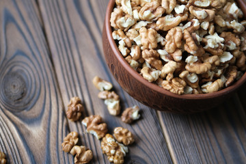 Walnuts on dark wooden background
