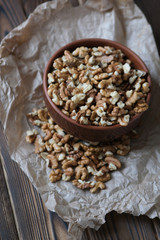 Walnuts on dark wooden background