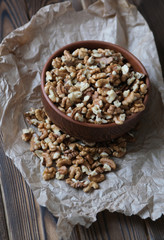 Walnuts on dark wooden background