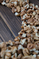 Walnuts on dark wooden background
