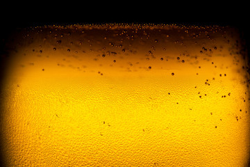 Beer bubbles, macro view,Close up background of beer with bubbles in glass