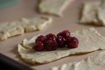 step by step cooking croissants with cherries. Baked in oven.