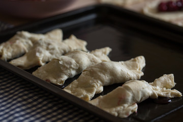 step by step cooking croissants with cherries. Baked in oven.