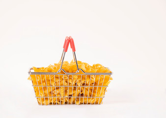 Shopping basket full of pasta on a white background