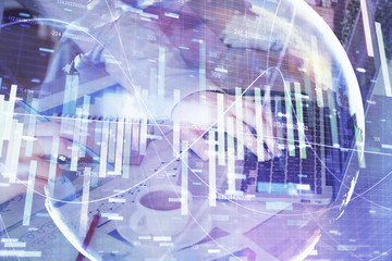 Double exposure of businessman working on laptop on background. International business hologram in front. Concept of success.