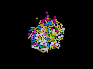 Colorful pills on a dark background