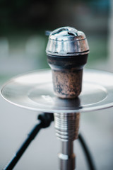 Metal hookah on a summer terrace with a blurred background