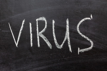 The inscription "virus" on a black board. White chalk