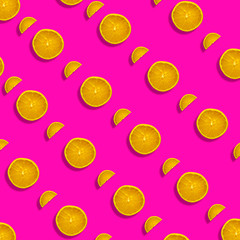 Fruit pattern of fresh orange tangerine or mandarin on lilac background. Flat lay, top view. Pop art design, creative summer concept. Citrus in minimal style.