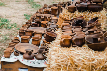 Brown handmade clay pots with blurry background