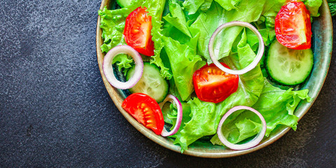 Healthy salad, leaves mix salad (mix micro greens, cucumber, tomato, onion, other ingredients). food background. copy space for text