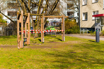 Obraz premium Playgrounds that were closed due to the corona pandemic, swings, soccer field, table tennis tables, barrier tape