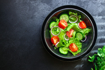 Healthy salad, leaves mix salad (mix micro greens, cucumber, tomato, onion, other ingredients). food background. copy space for text