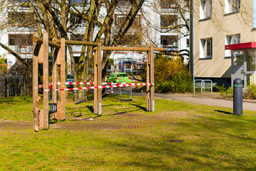 Obraz premium Playgrounds that were closed due to the corona pandemic, swings, soccer field, table tennis tables, barrier tape