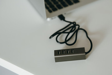 Closeup usb-hub connected to laptop