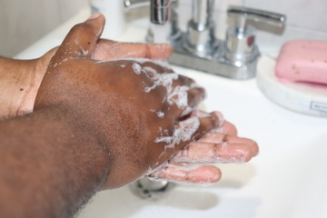 Fototapeta premium Man washing hands with soap