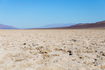 Fototapeta na wymiar View of the Basins salt flats, Badwater Basin, Death Valley, Inyo County, salt Badwater formations in Death Valley National Park. California, USA (Selectiv focus)