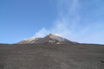 Crater of a volcano still steaming after an eruption
