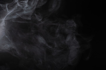 White steam on a black background.