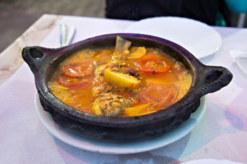 Tajine with stewed vegetables and fish. One of the types of Moroccan national cuisine.
