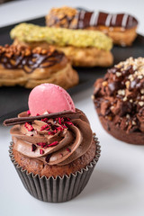 beautiful and delicious cakes, muffins, eclairs, macaron cookies