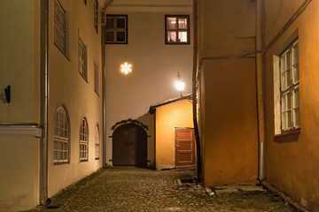 Night view of the old courtyard in the historical part of Tallinn. The city is the capital and the most populous city of Estonia.