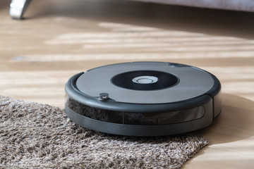 robot vacuum cleaner cleaning a carpet