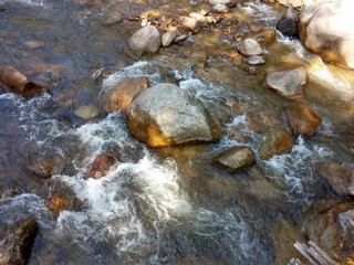 River flowing through the rocks In the natural streams