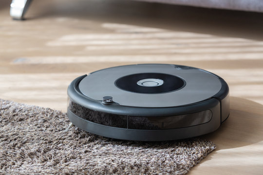 Robot Vacuum Cleaner Cleaning A Carpet