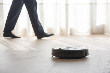 robot vacuum cleaner cleaning a living room