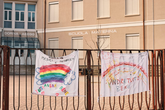 Banner with hope phrases made by kids in front of a closed school due to the coronavirus covid-19 outbreak 
